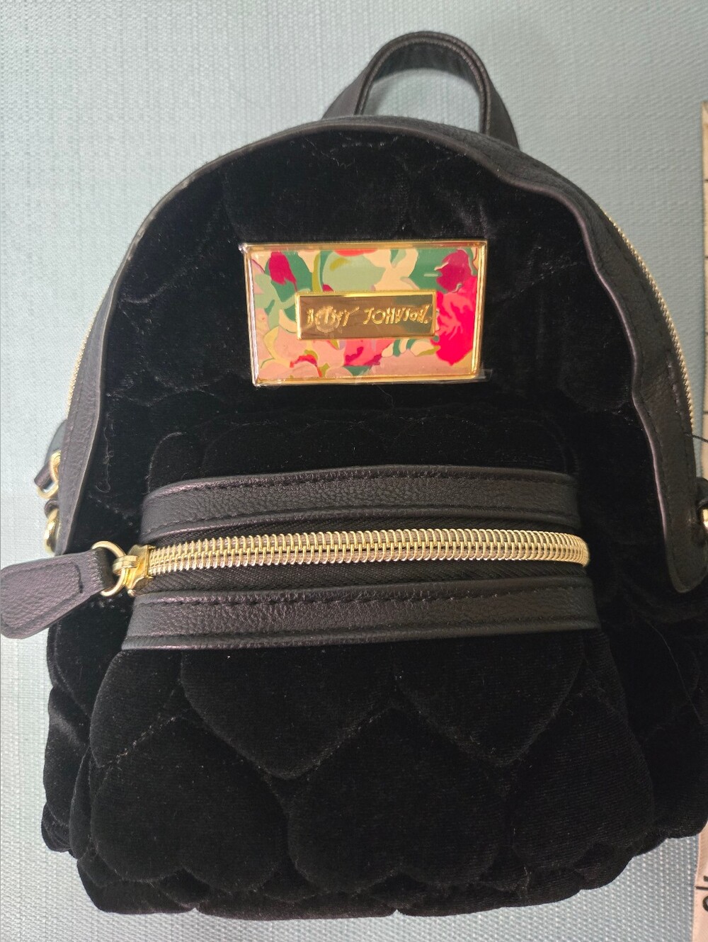 Betsey Johnson Black Quilted Velvet Mini Backpack with Floral Plaque